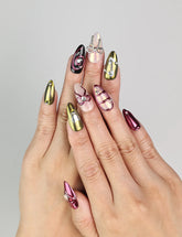 Model wearing Glossy Love coquette nails with glossy red and pink hearts, Naillover handmade Singapore press on nails.